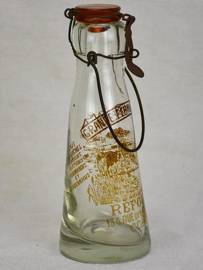 Antique French glass milk bottle with brown decoration