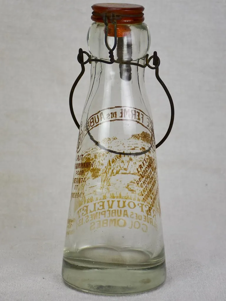 Antique French glass milk bottle with brown decoration